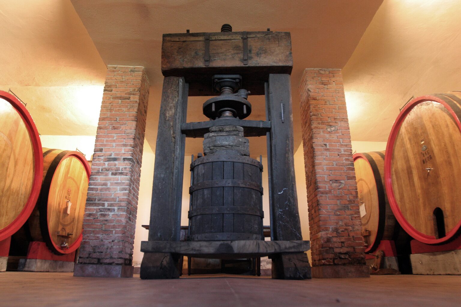 A wooden wine press at Tenute Silvio Nardi