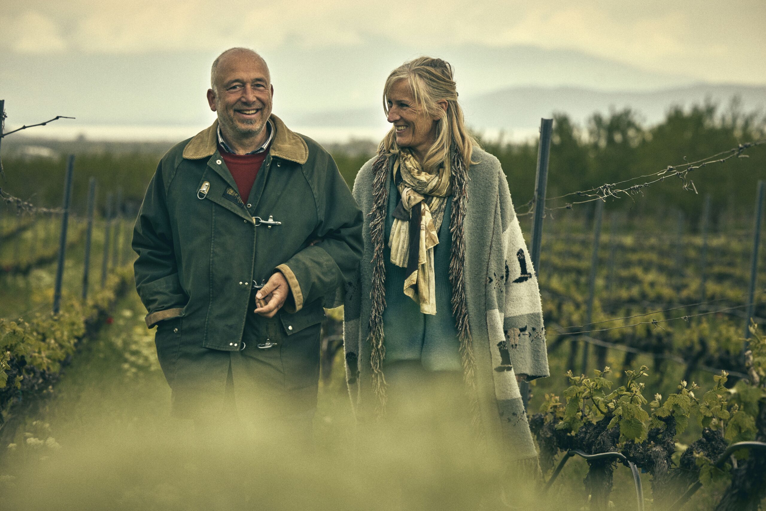 A couple walks in thye fields