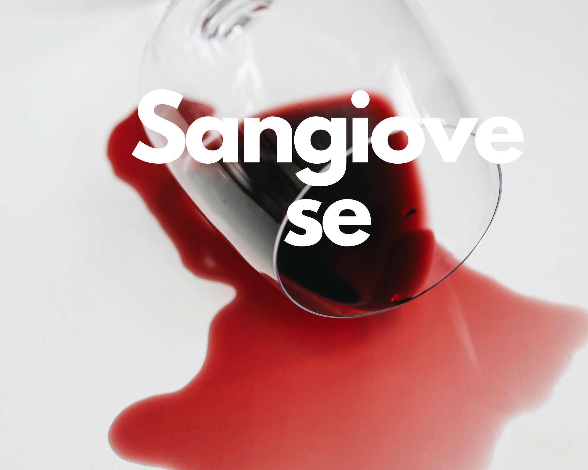 A glass of spilled red wine in a white background, Italian grape varieties