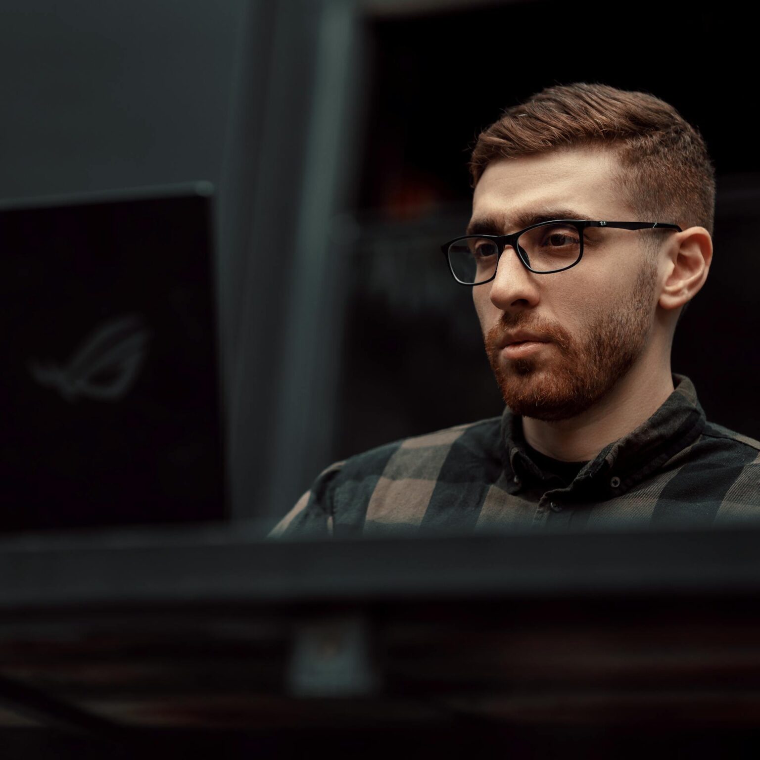 A man in front of his laptop