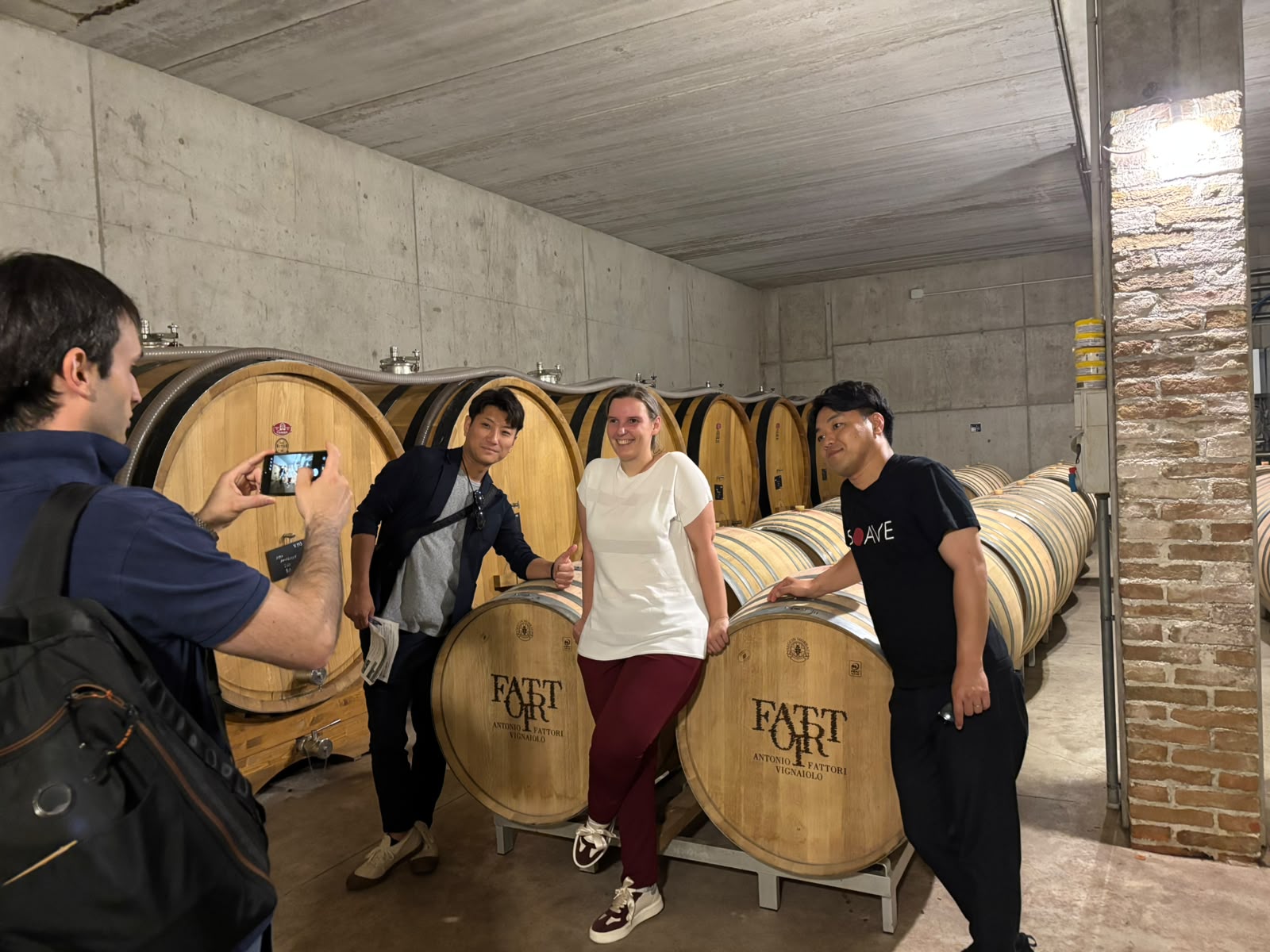 A team of 3 persons at a wine cellar